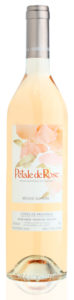 a pink wine bottle with silver cap of le pétale de rose, organic rosé wine of barbeyrolles vineyard, france